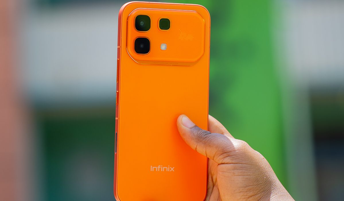 Hand holding Infinix hot 60 pro phone