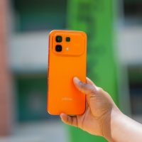 Hand holding Infinix hot 60 pro phone