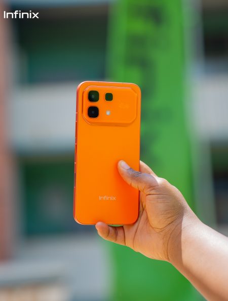 Hand holding Infinix hot 60 pro phone