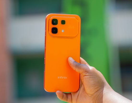 Hand holding Infinix hot 60 pro phone